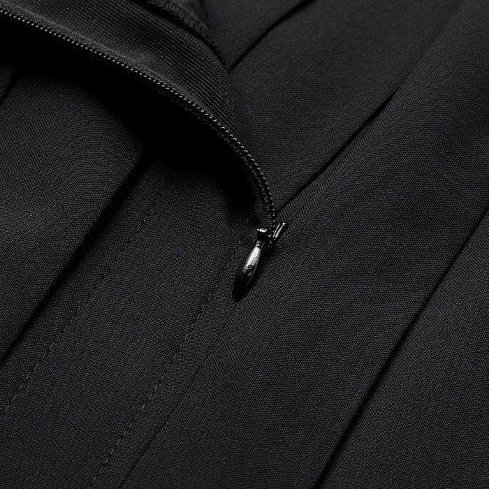 Crafted from warming yet breathable wool-blend fabric that's pleated for added dimension.