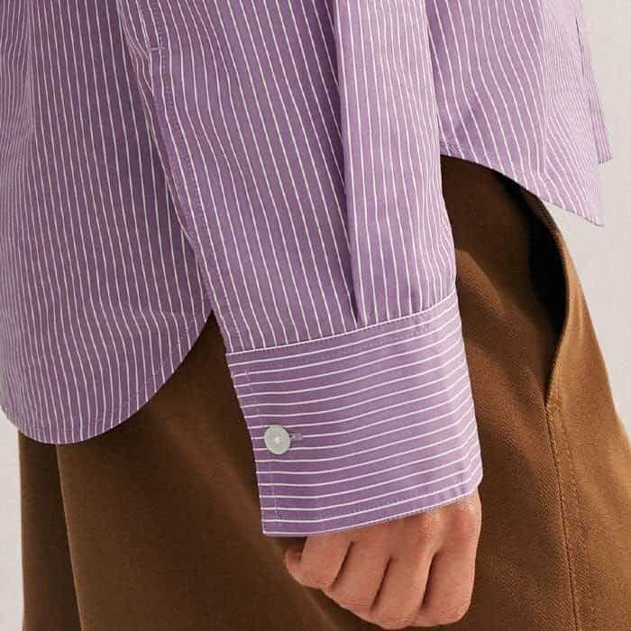 A button detail at the cuff allows you to switch between a narrow, neater fit or a wider cuff for ease when rolling up the sleeves.