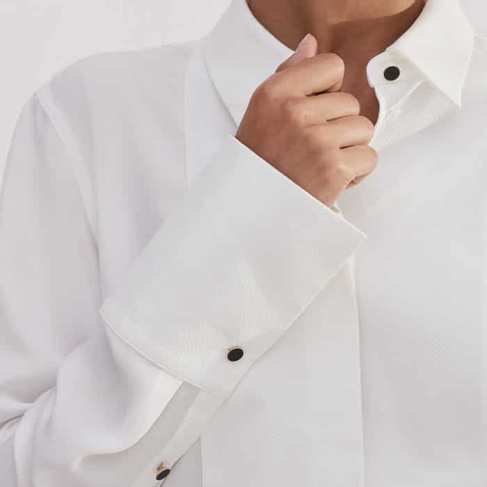 A button detail at the cuff allows you to switch between a narrow, neater fit or a wider cuff for ease when rolling up the sleeves.