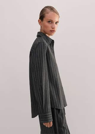 Made from Italian wool-blend tailoring fabric with a subtly brushed surface and camel-hued pinstripes.