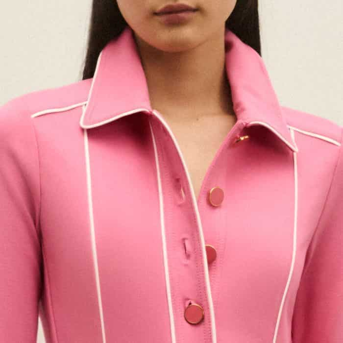 The buttoned neckline can be left undone for a more relaxed finish.