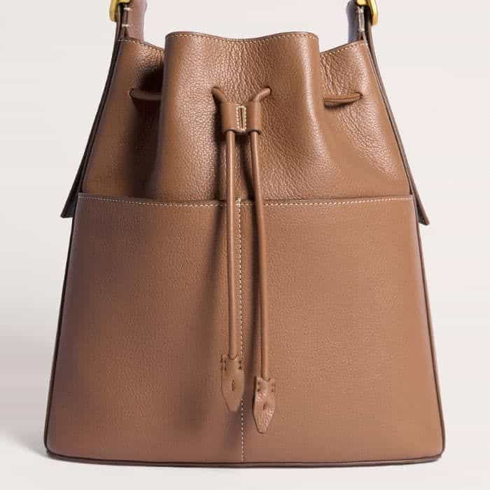 With a slouchy finish, the drawstring of the bag can be pulled in to keep all your belongings secure.