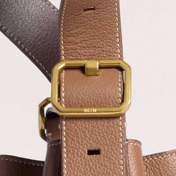 The buckle is elevated with ME+EM block branding.