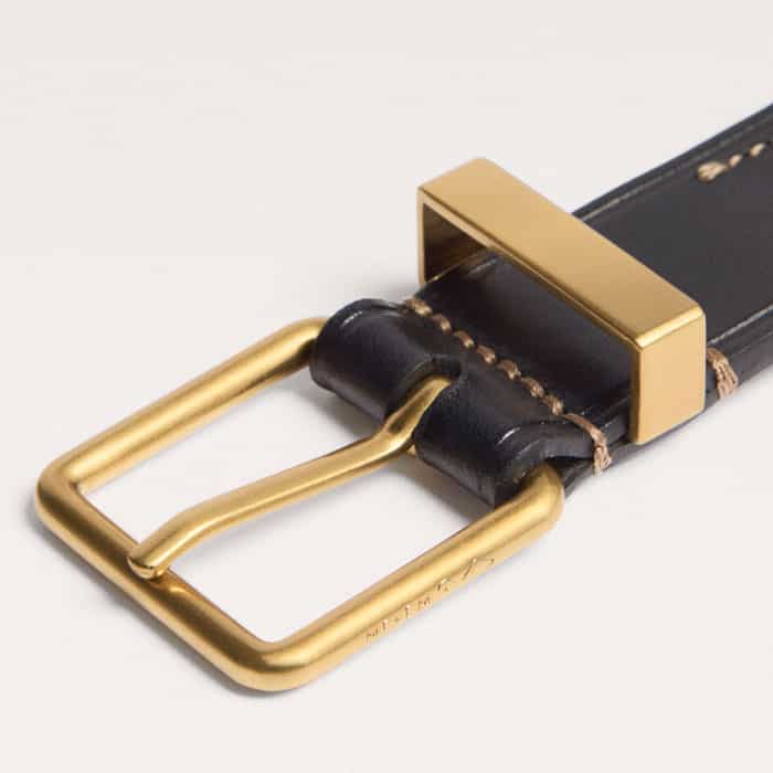 The buckle and keeper are rendered in old-English brass gold bespoke branded hardware.