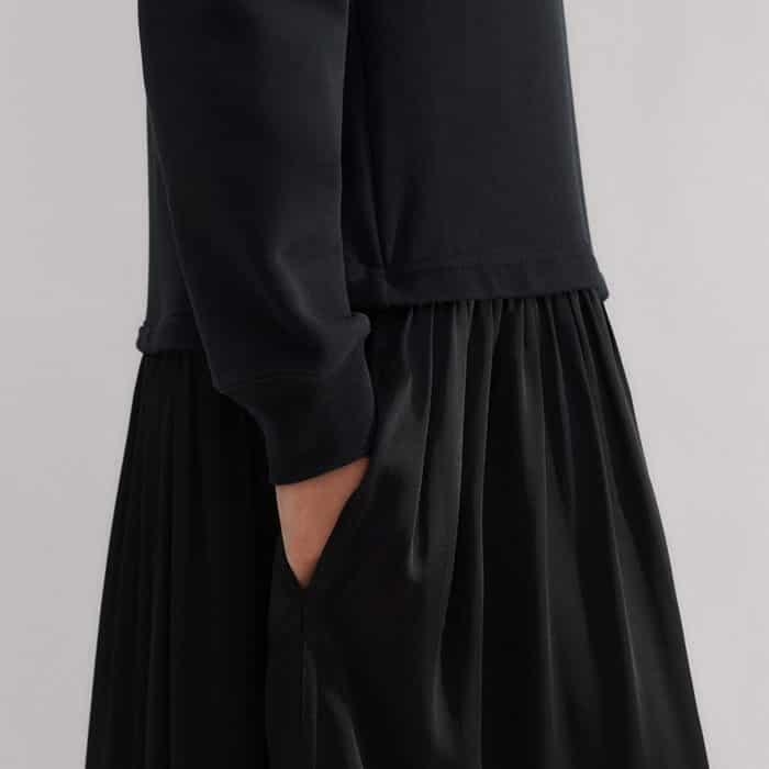 The relaxed sweatshirting of the top contrasts with the sateen woven of the skirt for a flattering texture clash.