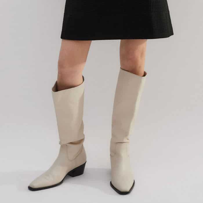 Keeping the shorter hemline in your cold-weather wardrobe, our Knee-High Slouch Western Boot fills the gap.