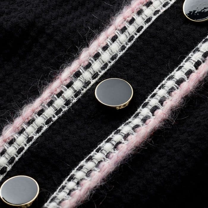 Crafted from heavyweight jacquard jersey with a textured geometric surface and contrasting knitted trims.