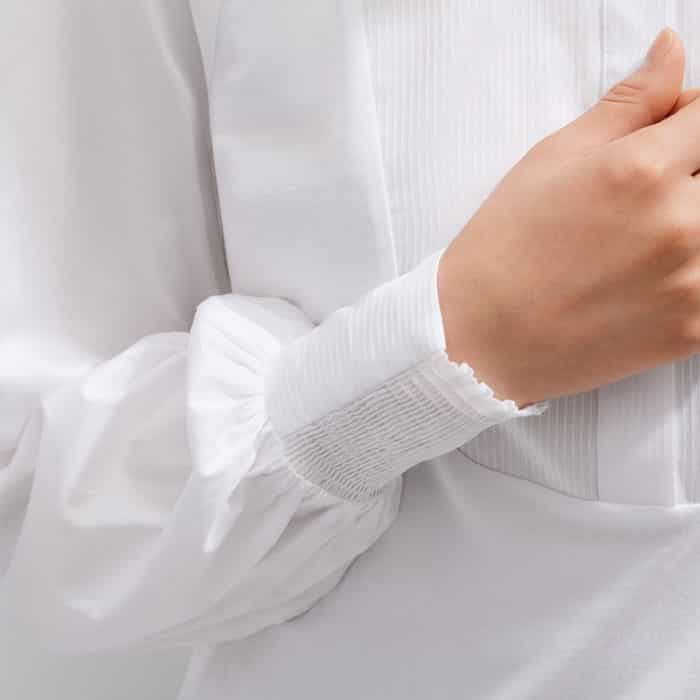 The cuffs are shirred on one side to keep pushed-up sleeves in place.