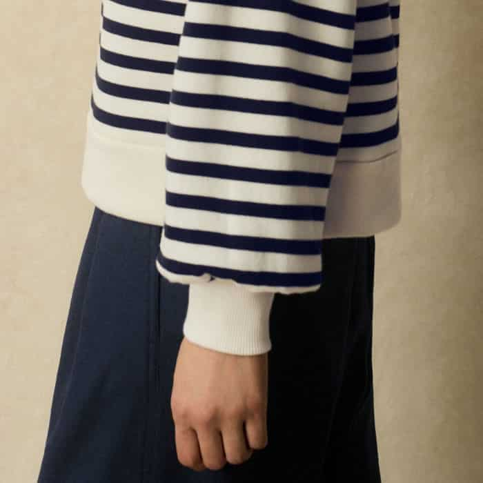 The long sleeves fall to fitted cuffs to keep pushed-up sleeves in place.