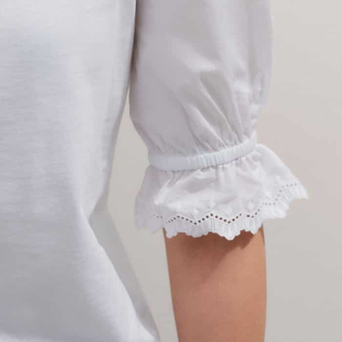 The short pouf sleeves fall to elasticated cuffs for a more voluminous finish.