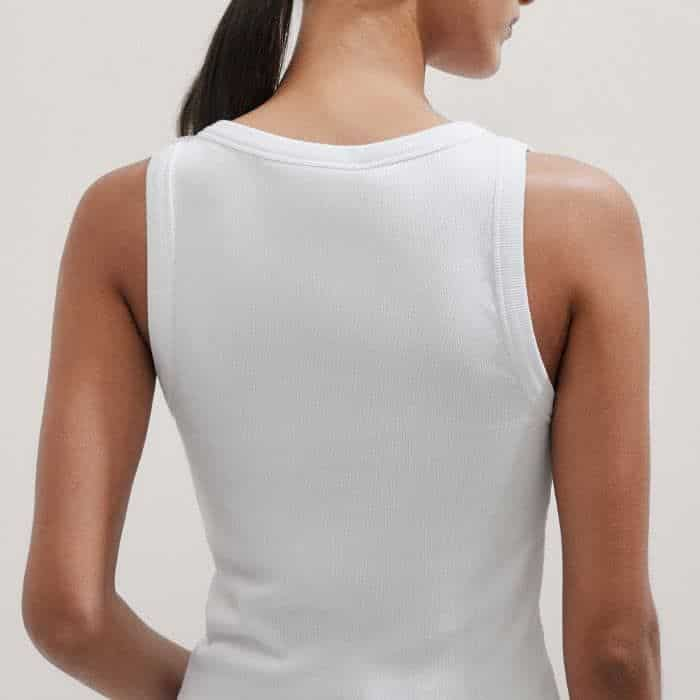 The sleeveless cut ensures a bulk-free finish when the piece is layered and the thick straps are designed to cover bra straps.