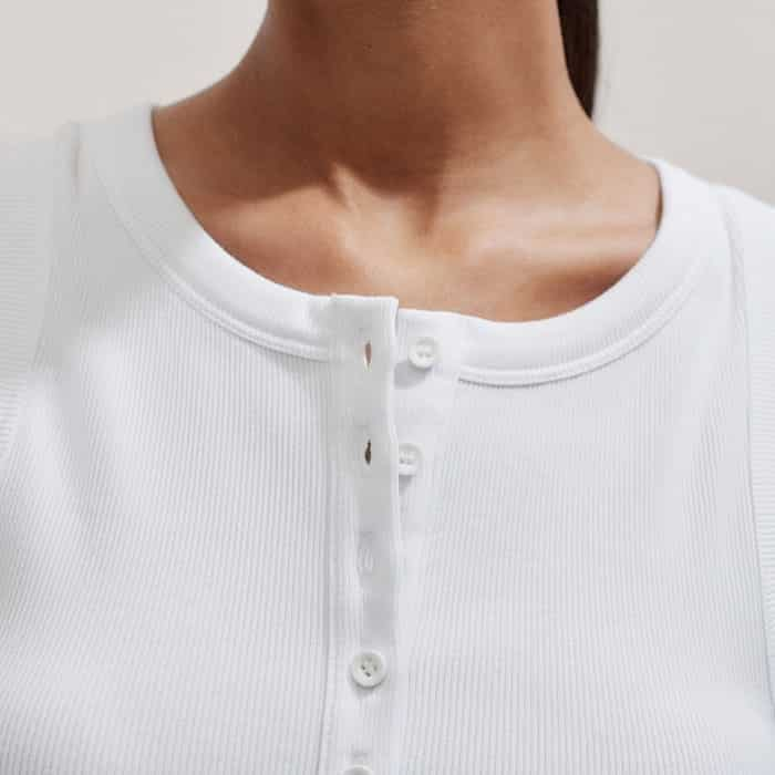 Switch between a modern crew neck and an open neckline with the adjustable half-button placket.