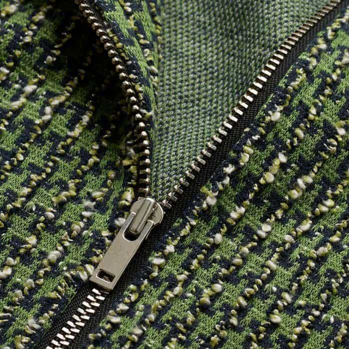 Crafted from mid-weight jacquard jersey with a textured tweed-like surface and a soft, crease-free finish.