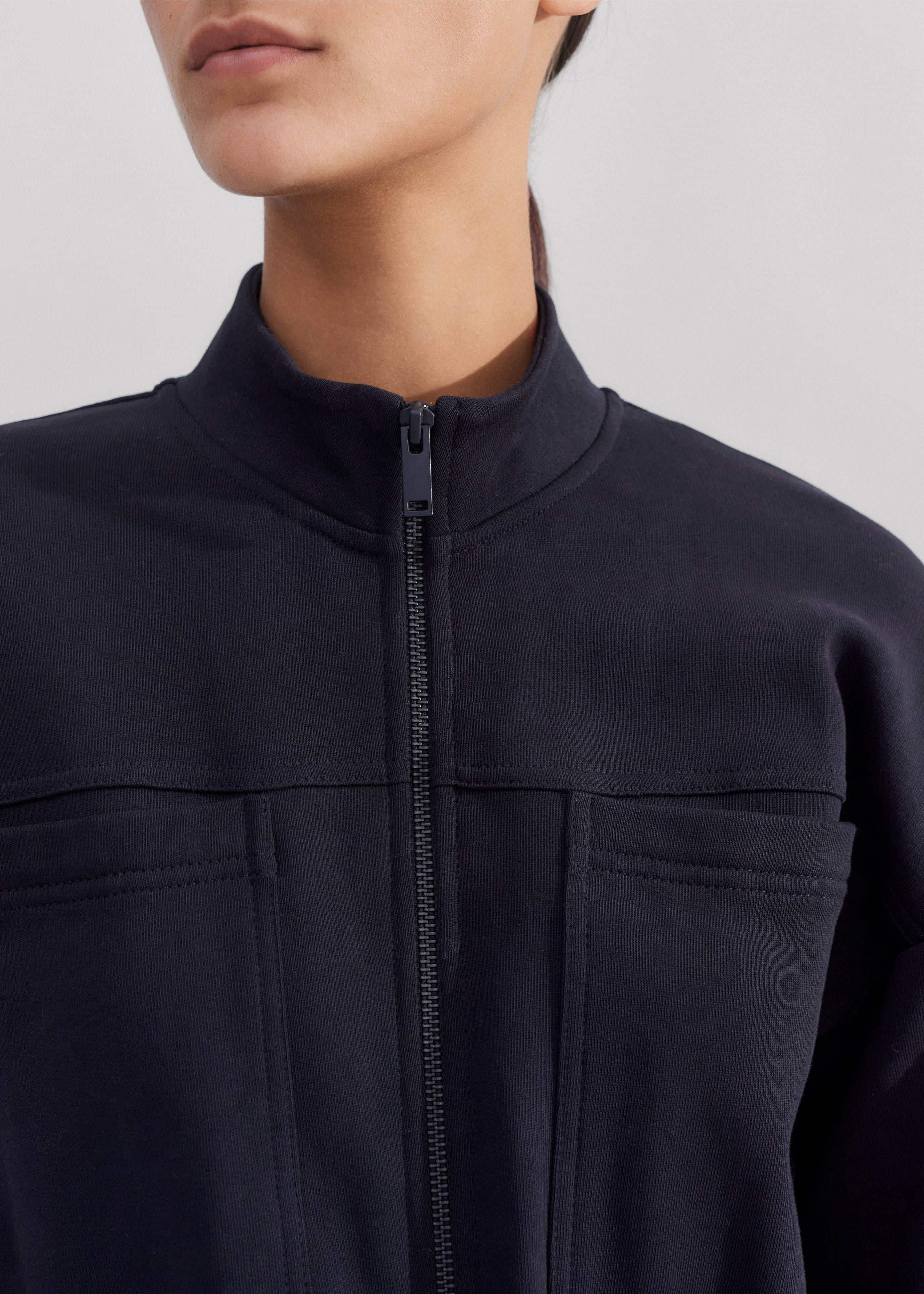 The zip at the neckline can be left undone to accommodate additional base layers.