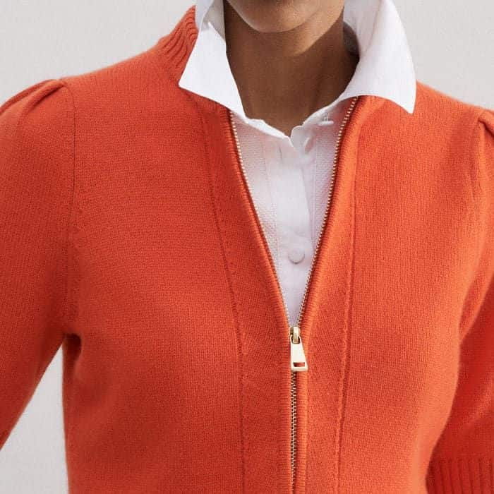 A gold-toned zip at the neckline can be left undone to accommodate additional underlayers.