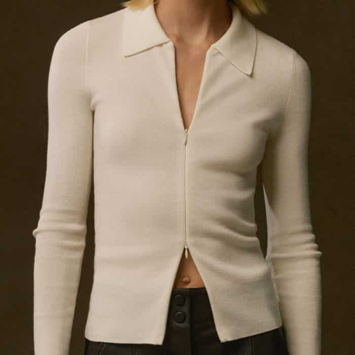 The sleeves are longer so that the cuffs show when this piece is styled under additional layers.