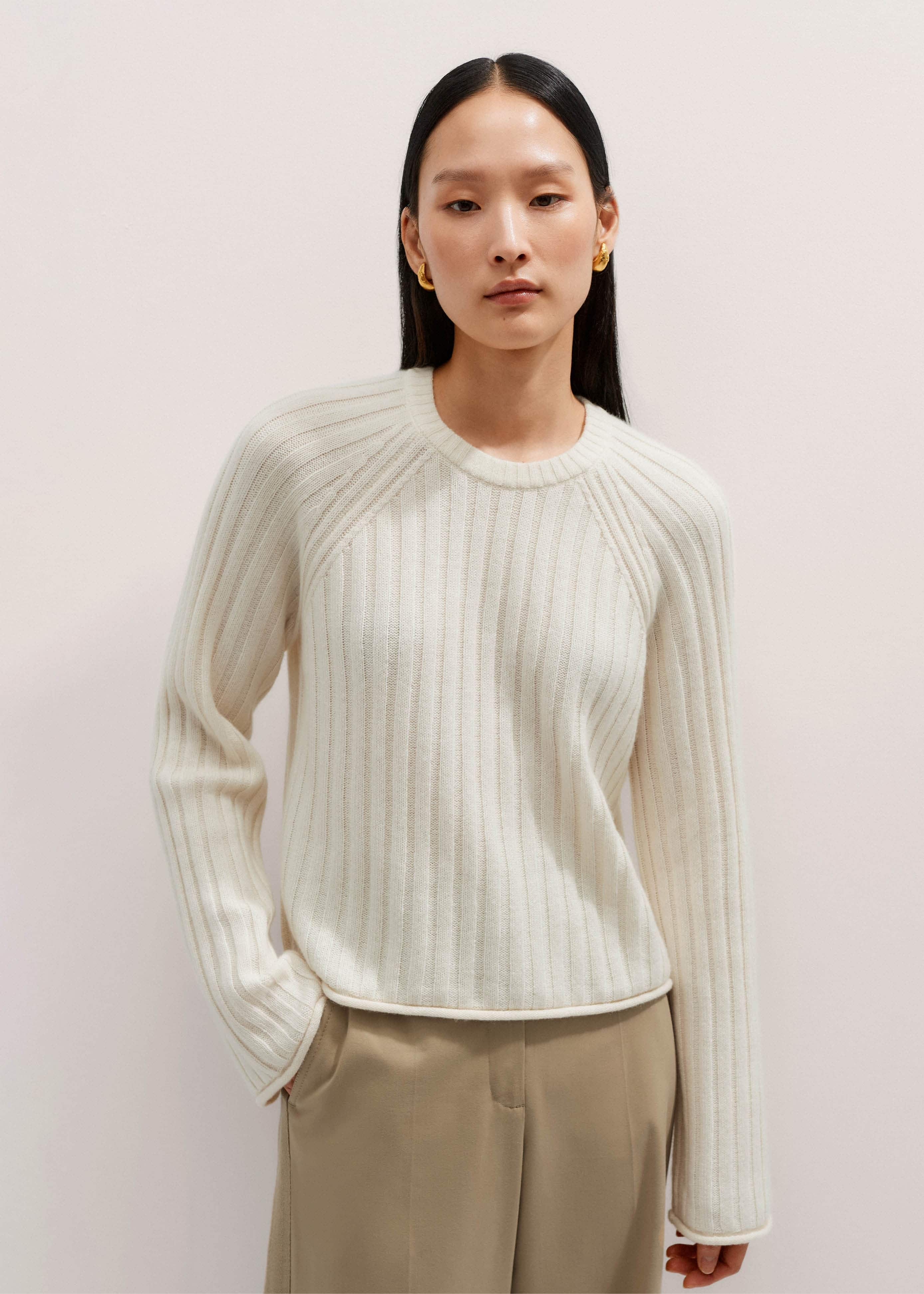 The raglan sleeves create a flattering dropped-shoulder look.