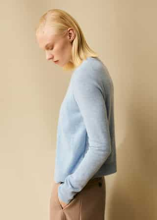 The vest underlayer is attached to the cardigan for the effortless ease of a one-piece.