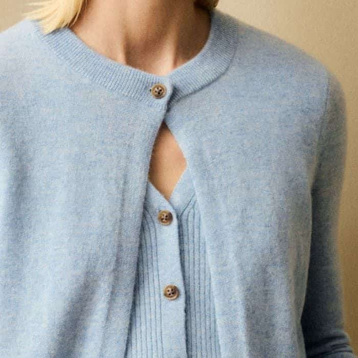 The vest underlayer is attached to the cardigan for the effortless ease of a one-piece.