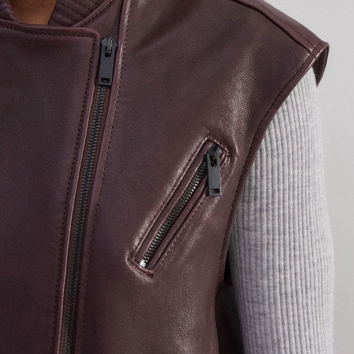 Slanted zip-up pockets add a functional and covetable edge to the piece.