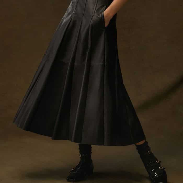 Pressed seams enhance the pleated detailing through the flared silhouette for flattering shape.