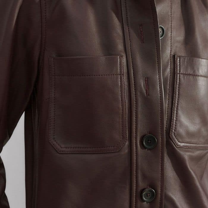 Pockets are positioned in front of the side seams and at the chest for a bulk-free, functional finish.