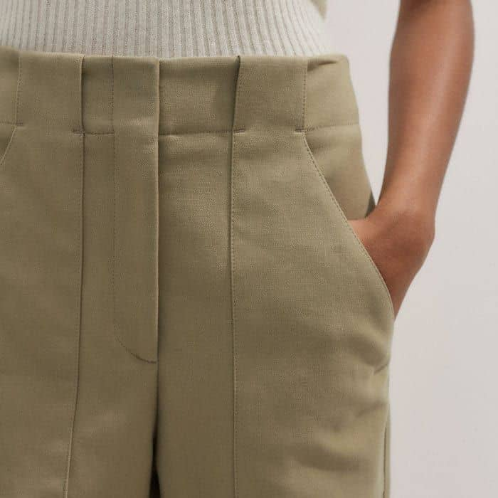 Deep front pockets introduce a functional element without adding bulk.