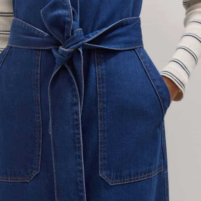 Four front pockets add functionality to the piece.