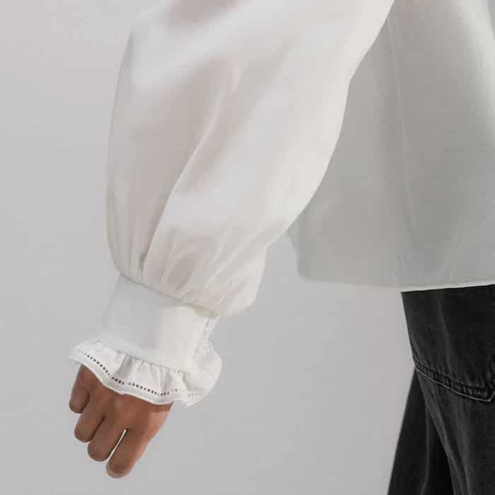 The cuffs are shirred on one side to maintain the shape of the sleeves and a polished finish at the front.