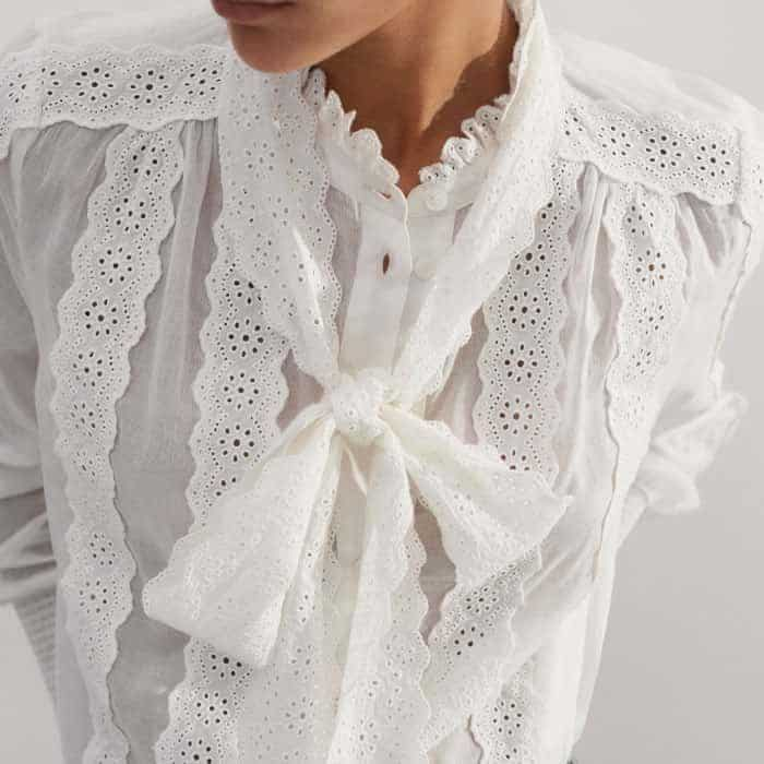 Crafted from soft lightweight cotton with broderie lace overlays and ties.