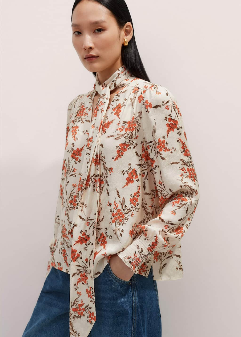 Crafted from fluid viscose crepe with a subtle textural jacquard that highlights the floral print.