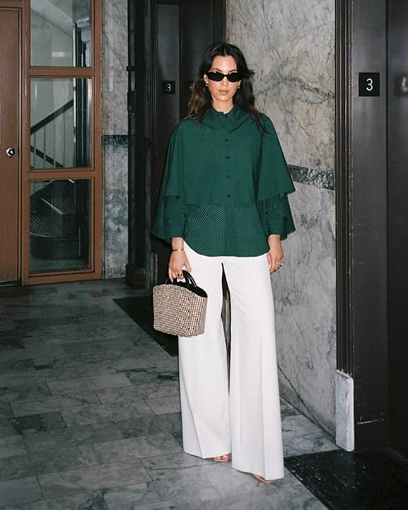 Green top white trousers