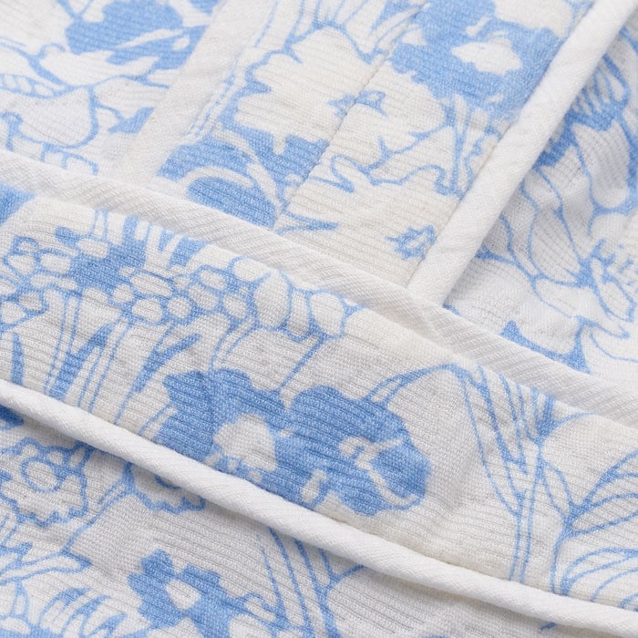 Breathable and structured, this cotton fabric features a jacquard design that creates texture and depth within our statement Gardenia print.