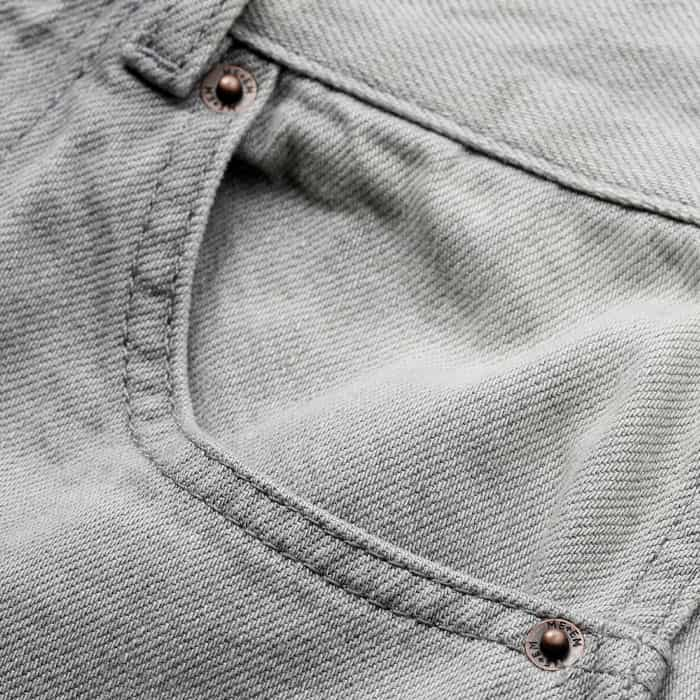 Crafted from cotton denim with a light grey wash. 