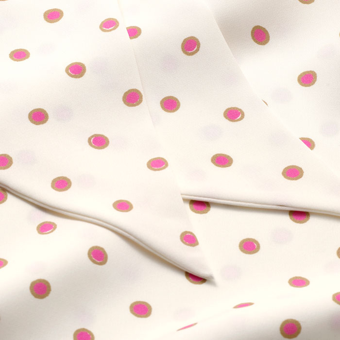 Pure lustrous silk in a playful polka-dot print in pink.