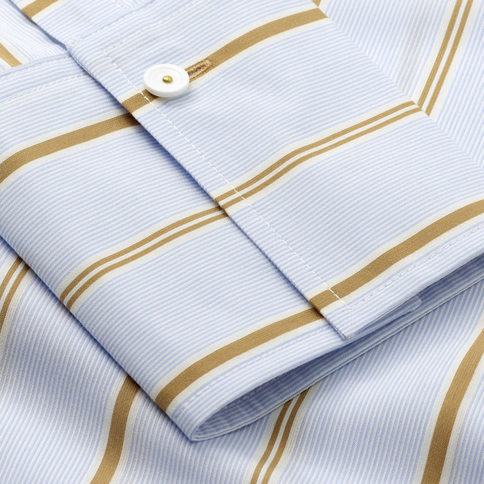 Viscose-blend shirting to give a soft hand feel, covered in a pale blue, white and camel-tone stripe, which draws colours from other collections.