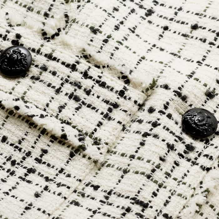 Crafted from an Italian cotton-blend tweed with tonal threads.