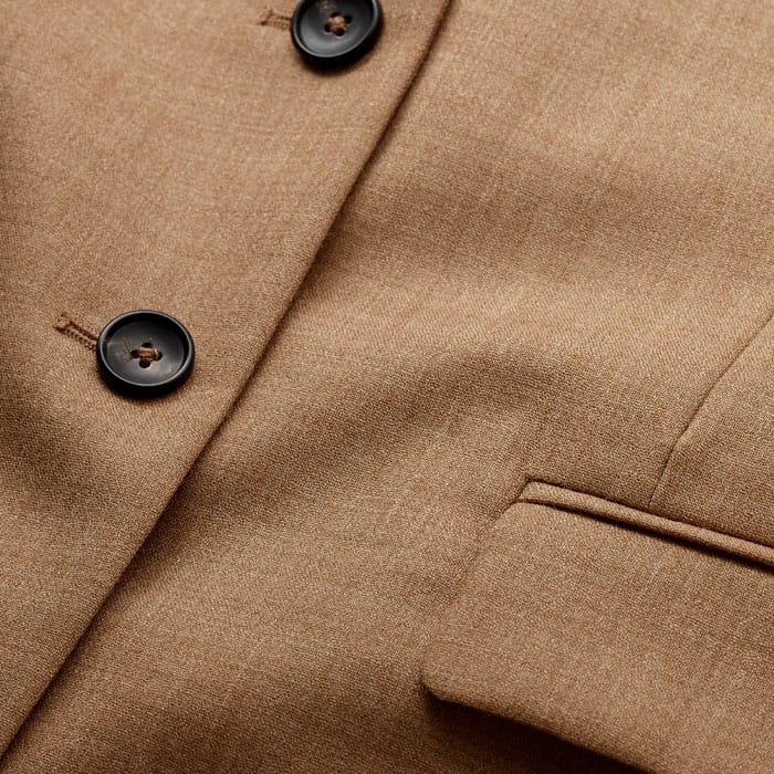 Crafted from Italian wool tailoring fabric with a lightweight feel and a fluid, drapey quality.