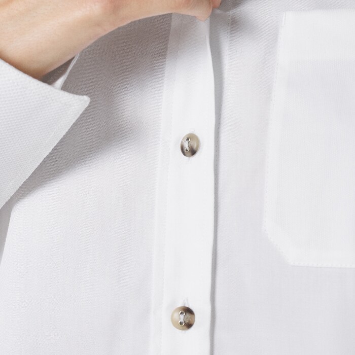 A white cotton shirt is a workwear essential. The long length updates the look to create interesting layers.