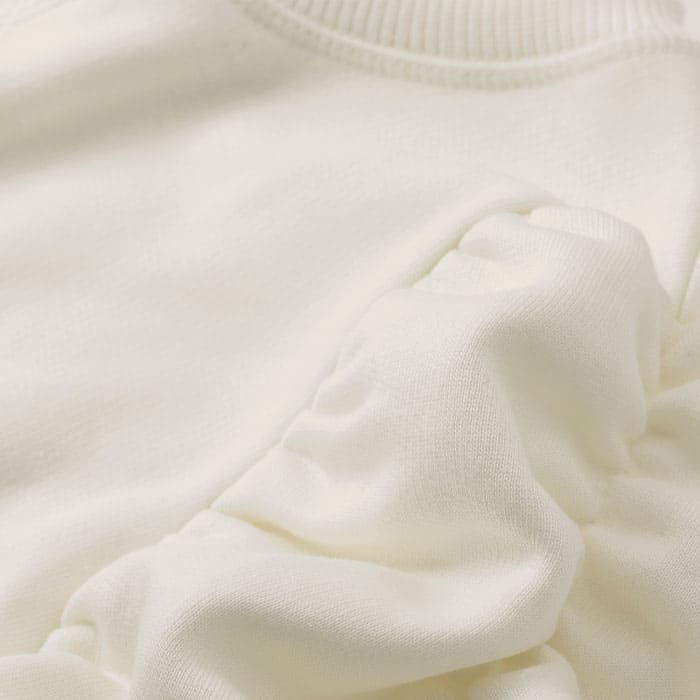 Crafted from heavyweight organic cotton fleeceback sweatshirting. This fabric has good shape retention and a soft hand feel, offering all the comfort of a jersey-stretch fabric.