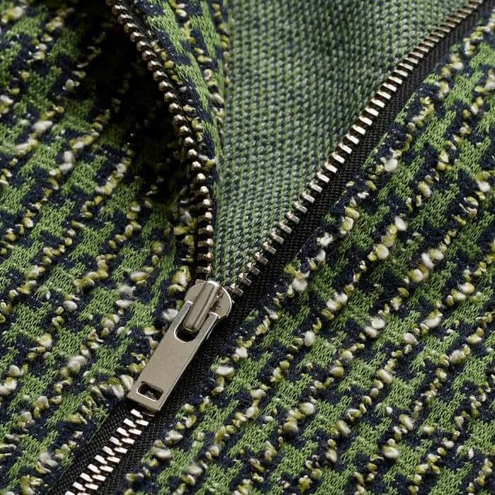 Crafted from mid-weight jacquard jersey with a textured tweed-like surface and a soft, crease-free finish.