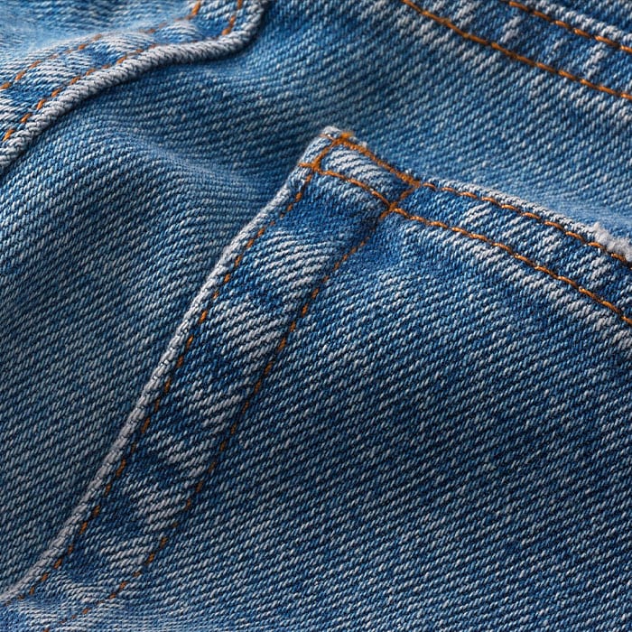 Cotton denim with comfort stretch. Featuring high-low wash techniques and just the right amount of distressing to add interest to warm-weather dressing.