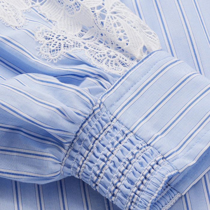 Crafted from cotton in a blue and white stripe, featuring statement lace at the sleeves.