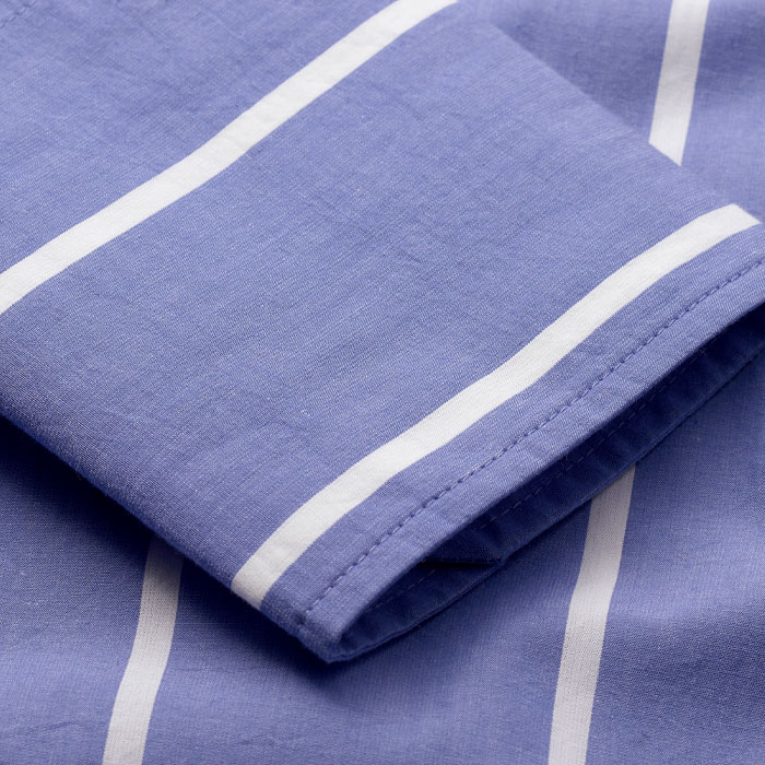 This lightweight cotton fabric features a simple stripe design that adds depth to your warm-weather wardrobe. 