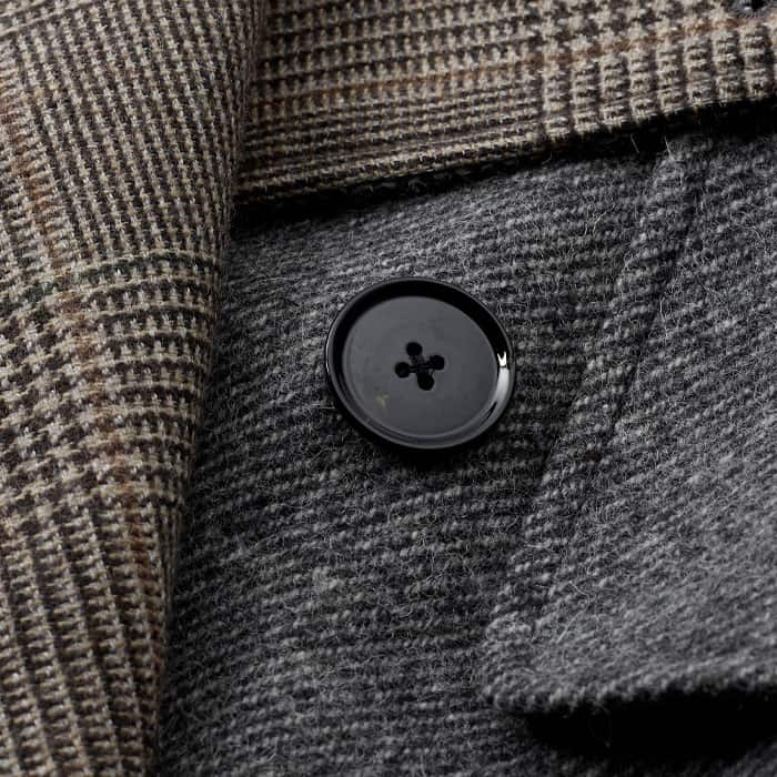 Crafted from double-faced Italian wool-blend fabric with a slightly brushed surface and a check pattern on both sides.