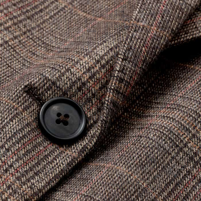 Crafted from an Italian wool-blend checked fabric with a slightly structured drape and a lightly felted surface. 