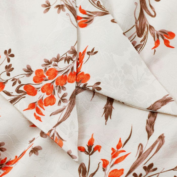 Crafted from fluid viscose crepe with a subtle textural jacquard that highlights the floral print.