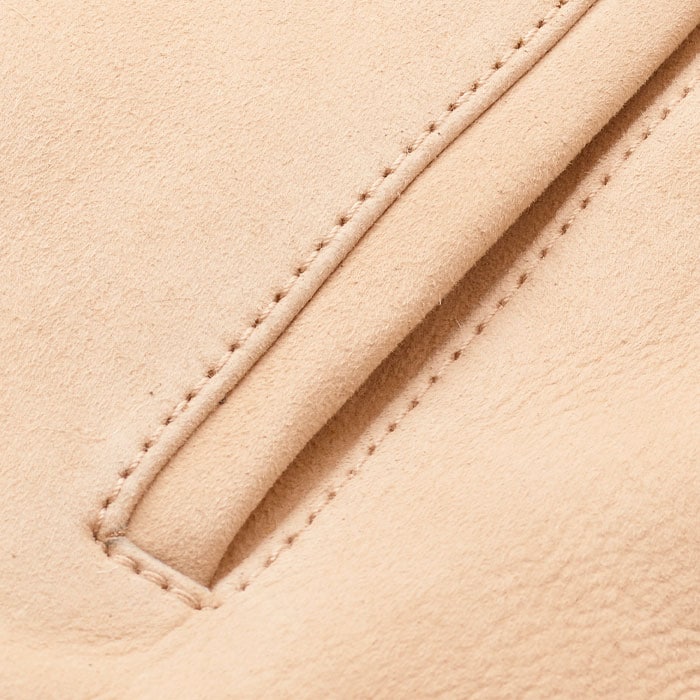 Crafted from shearling leather. This statement shearling features a soft finish on one side and suede-touch leather on the other. 