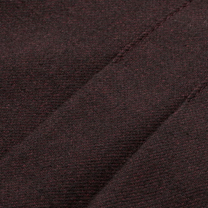 Italian tailoring fabric which has a twill finish, in deep cabernet.