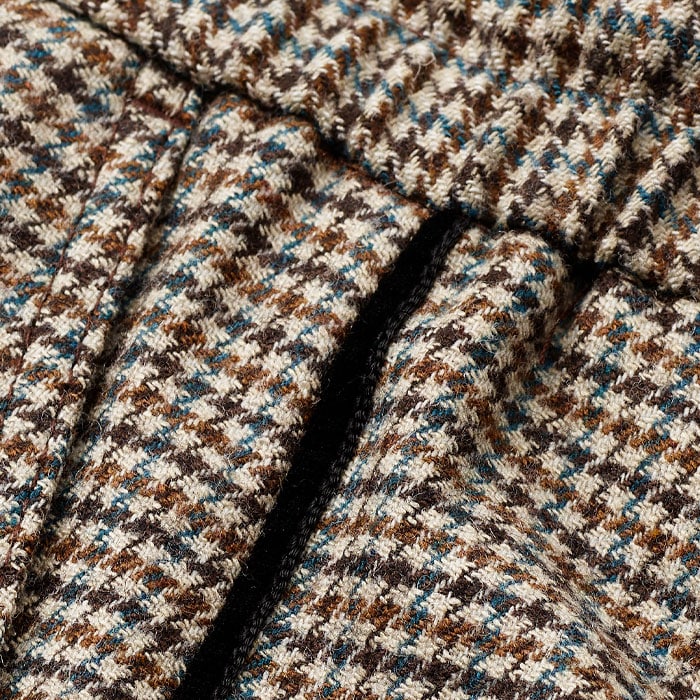 Made from an Italian wool blend in a houndstooth pattern.